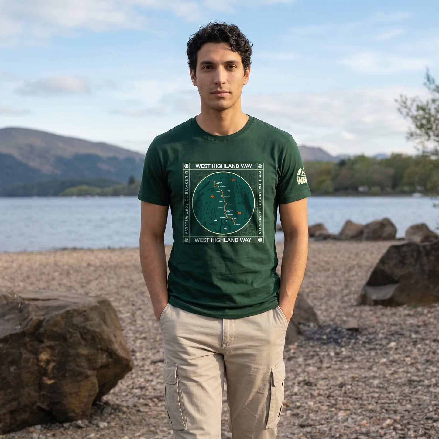 Front view of man wearing forest green west highland way map organic cotton t-shirt