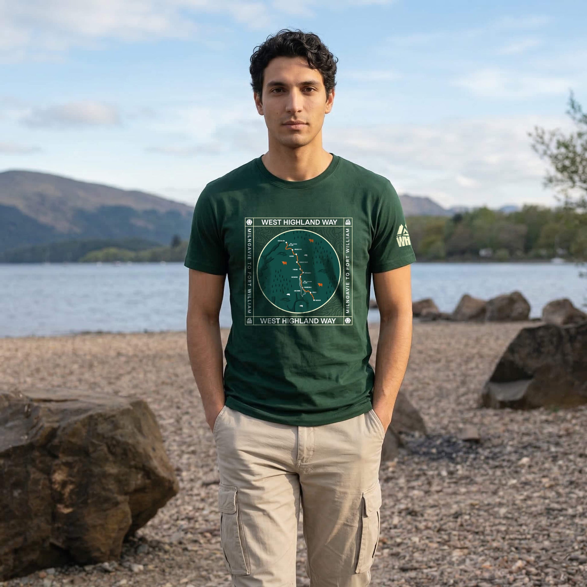 Front view of man wearing forest green west highland way map organic cotton t-shirt