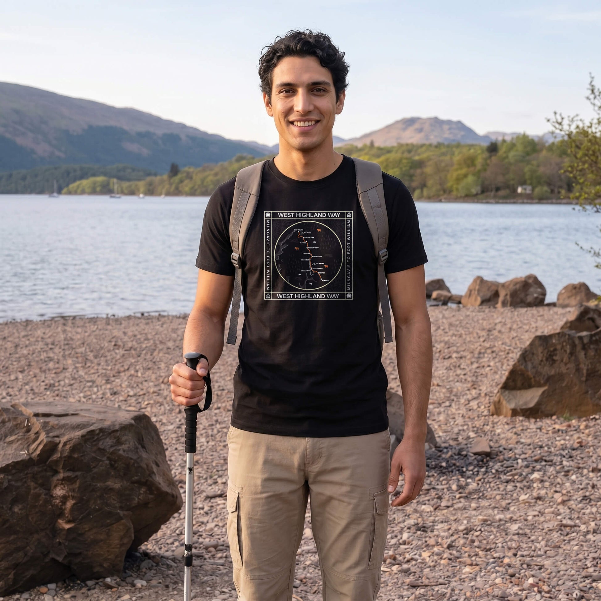 Front view of man wearing black West Highland Way map organic cotton t-shirt