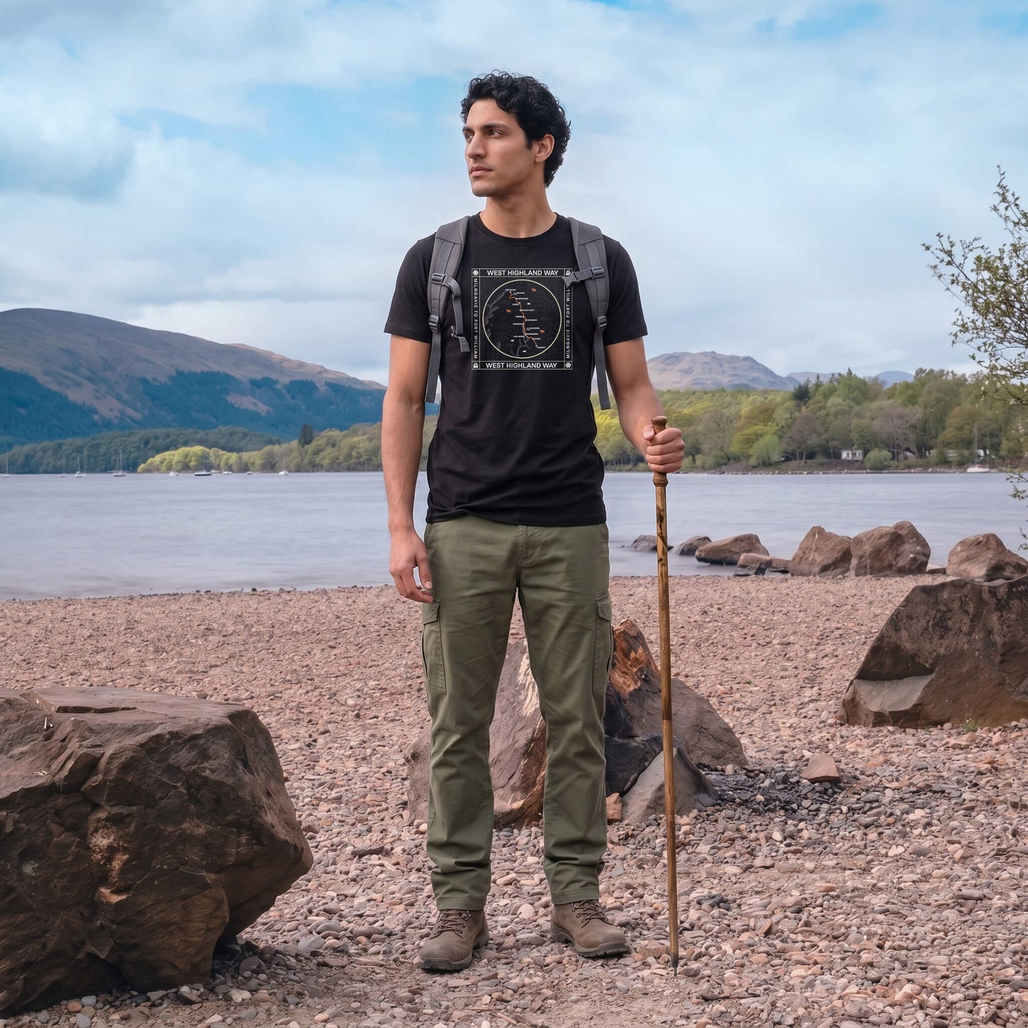 Front view of man wearing black West Highland Way map organic cotton t-shirt