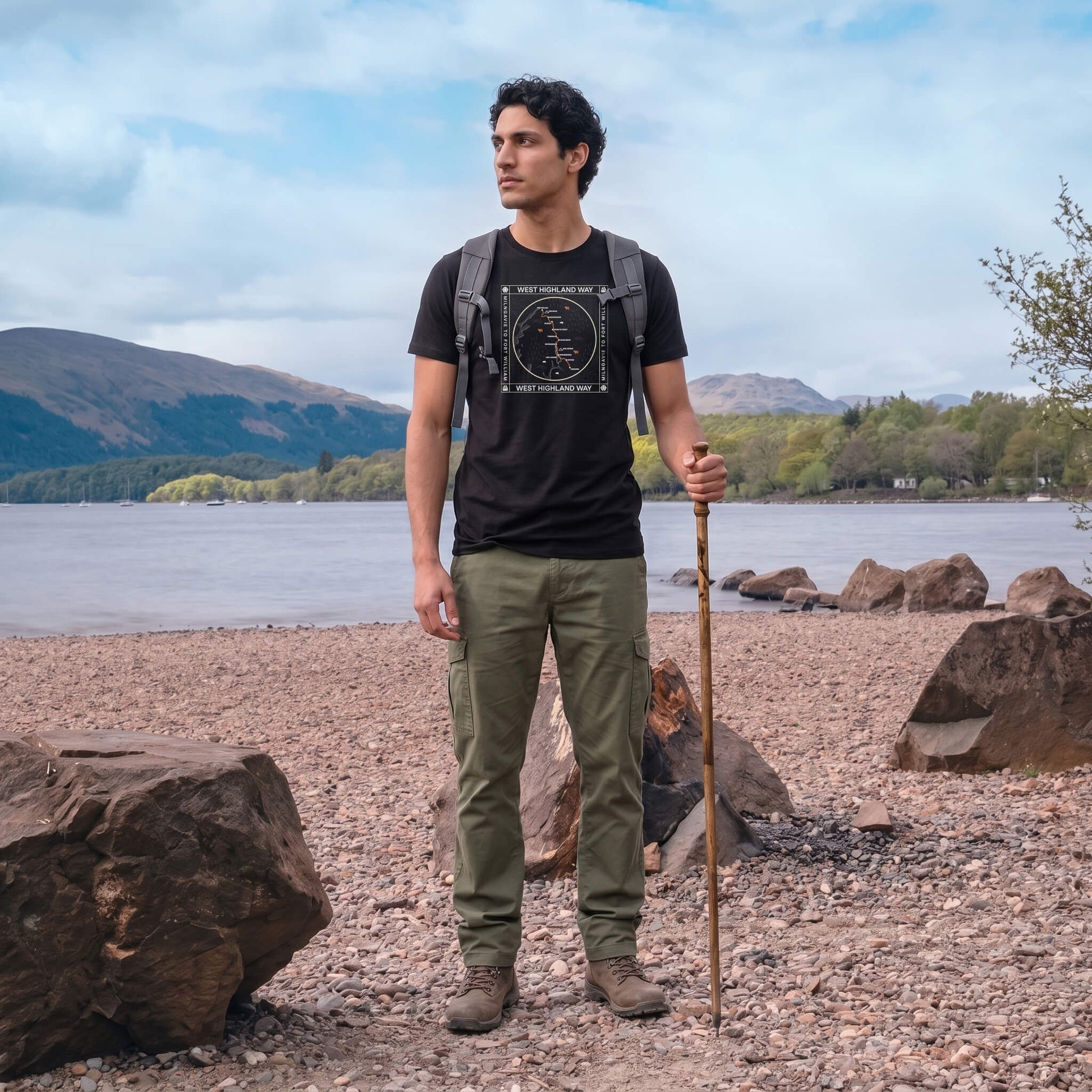 Front view of man wearing black West Highland Way map organic cotton t-shirt