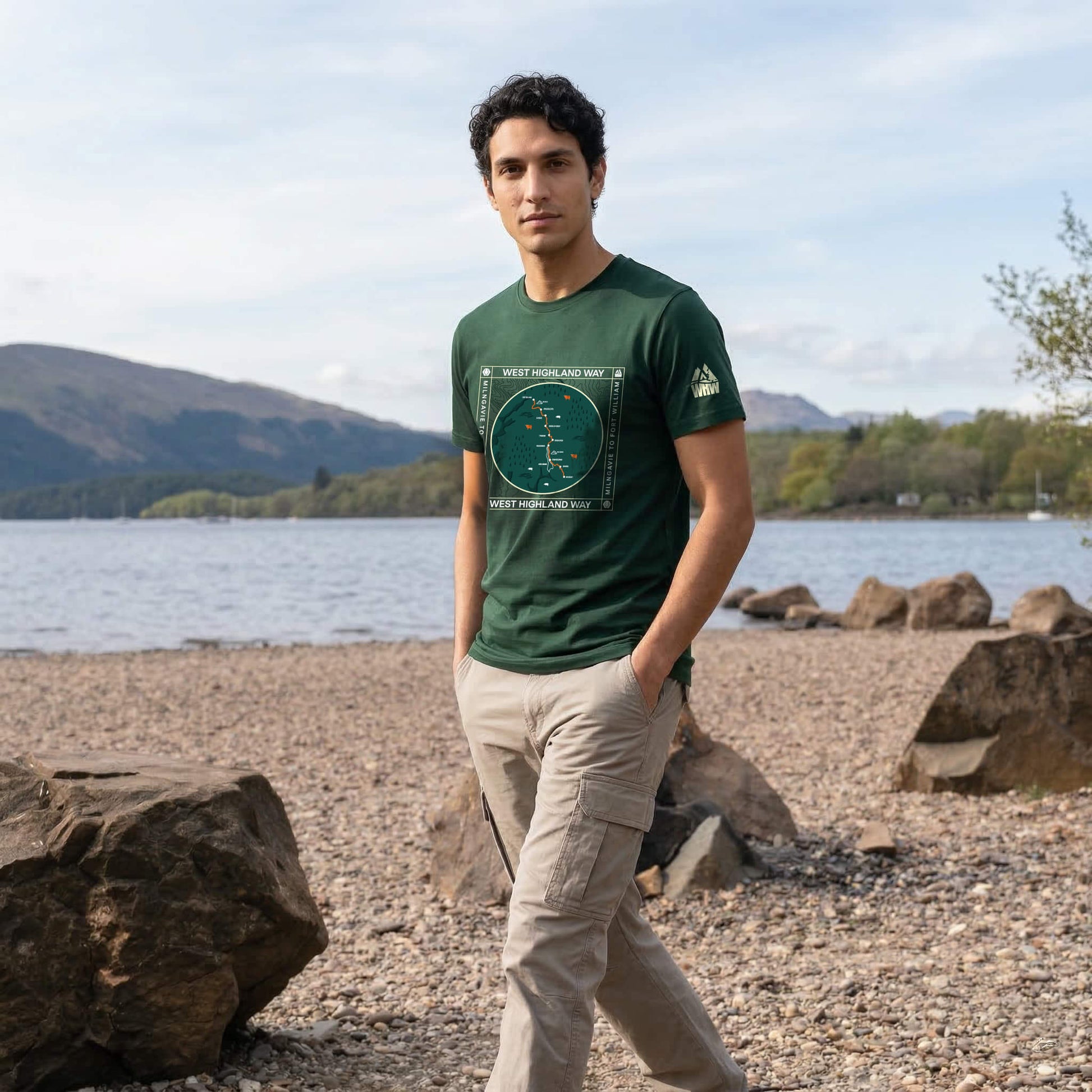 Three quarter view of man wearing forest green west highland way map organic cotton t-shirt