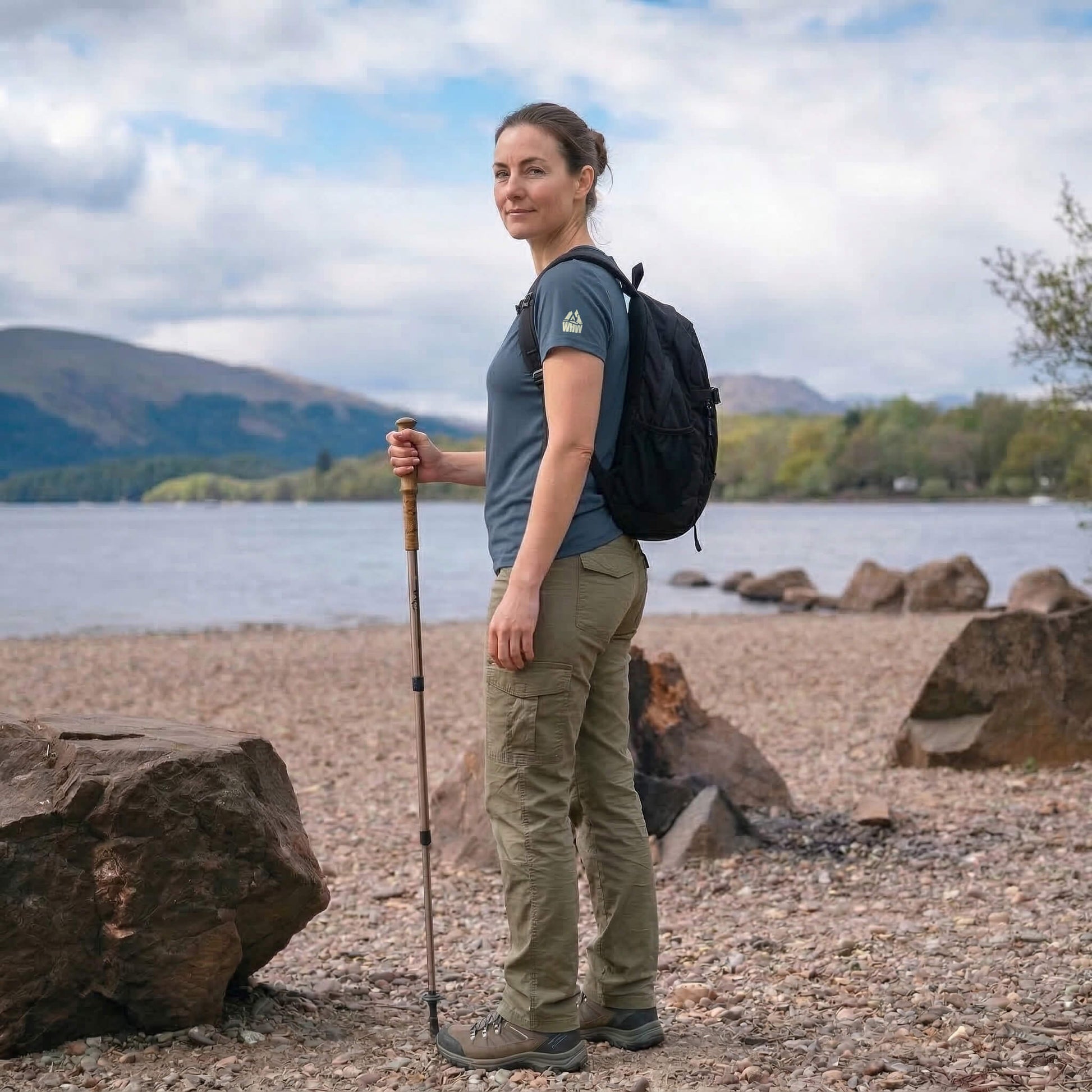 Side view of woman wearing blue steel west highland way map tech t-shirt