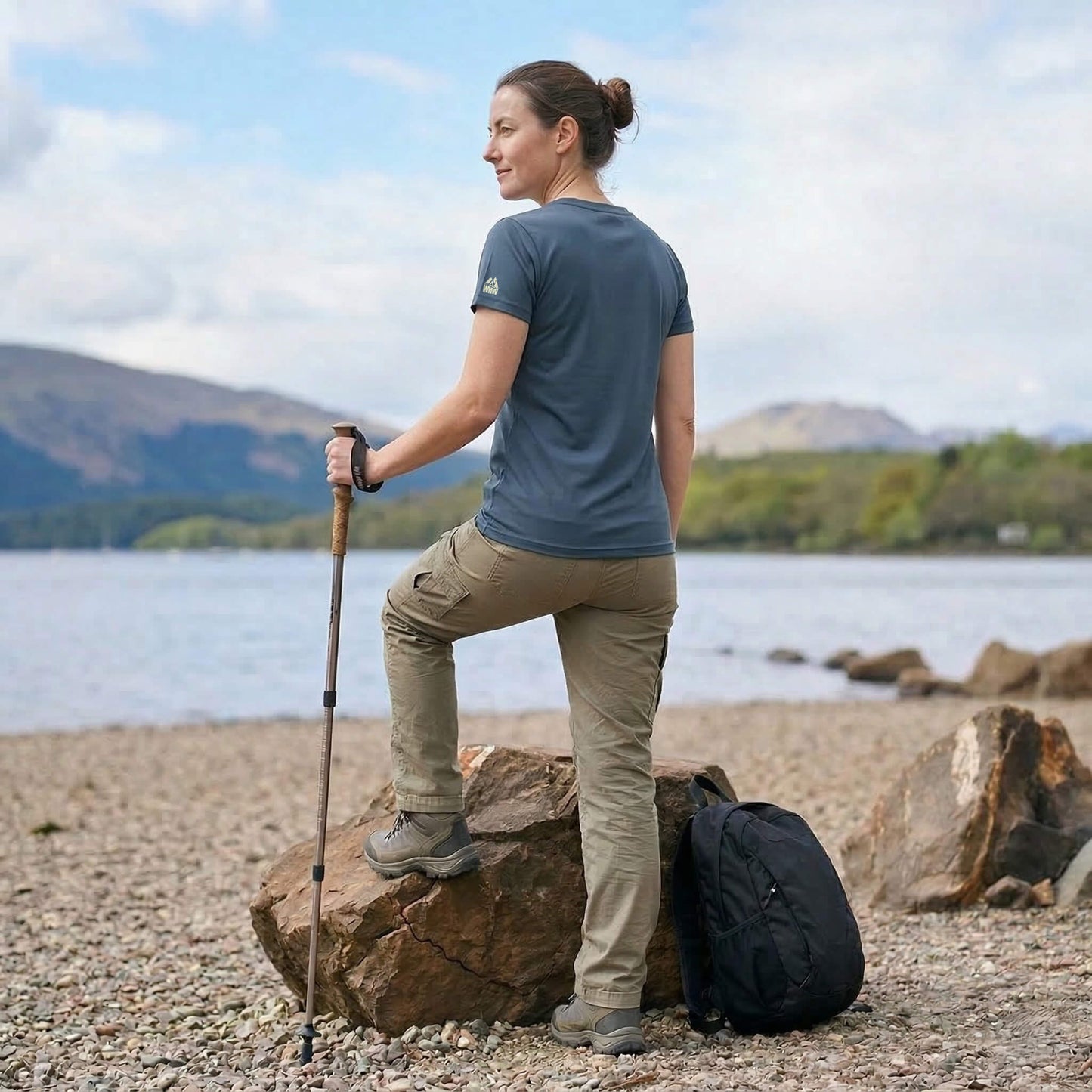 Back view of woman wearing blue steel west highland way map tech t-shirt