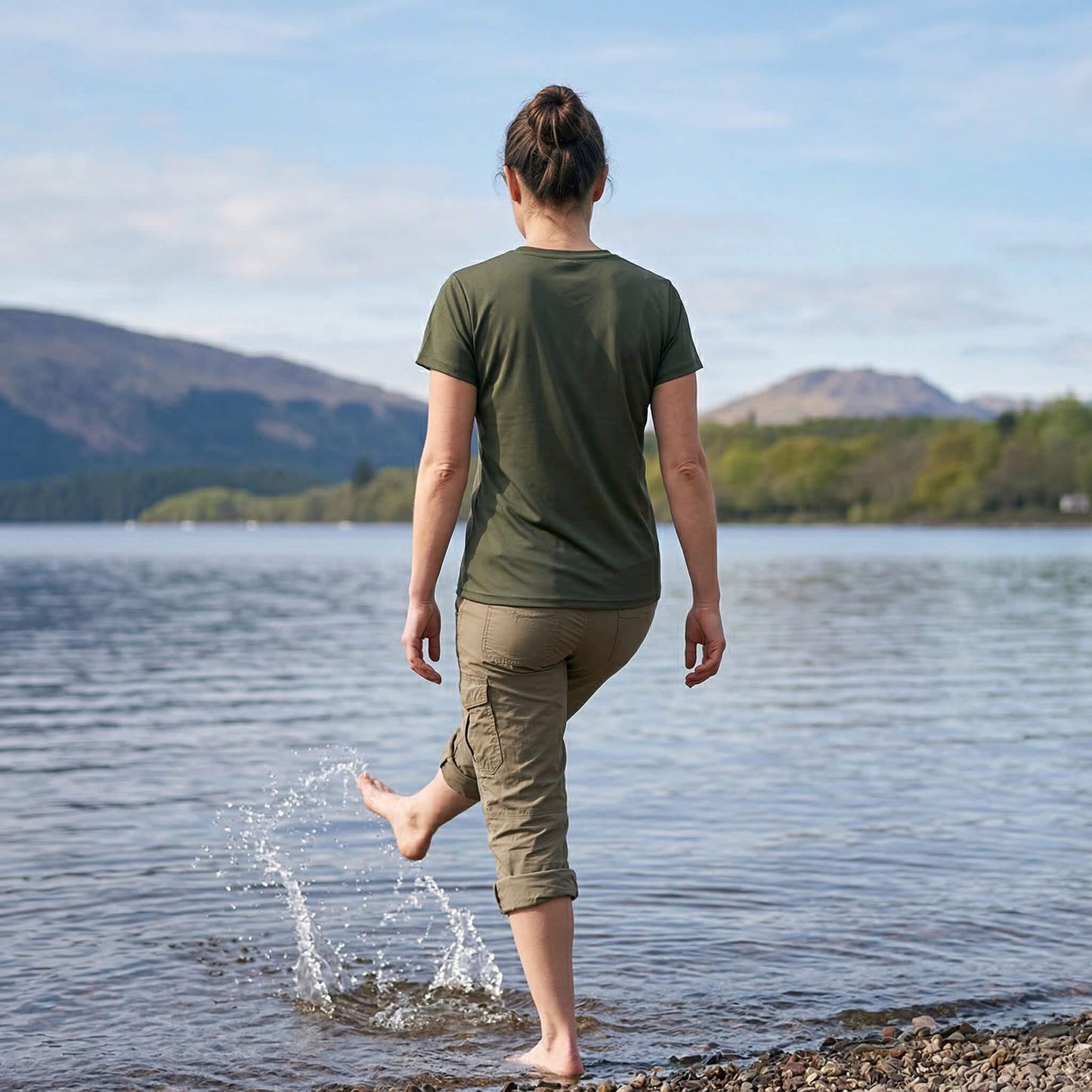 Back view of woman wearing moss green west highland way map tech t-shirt
