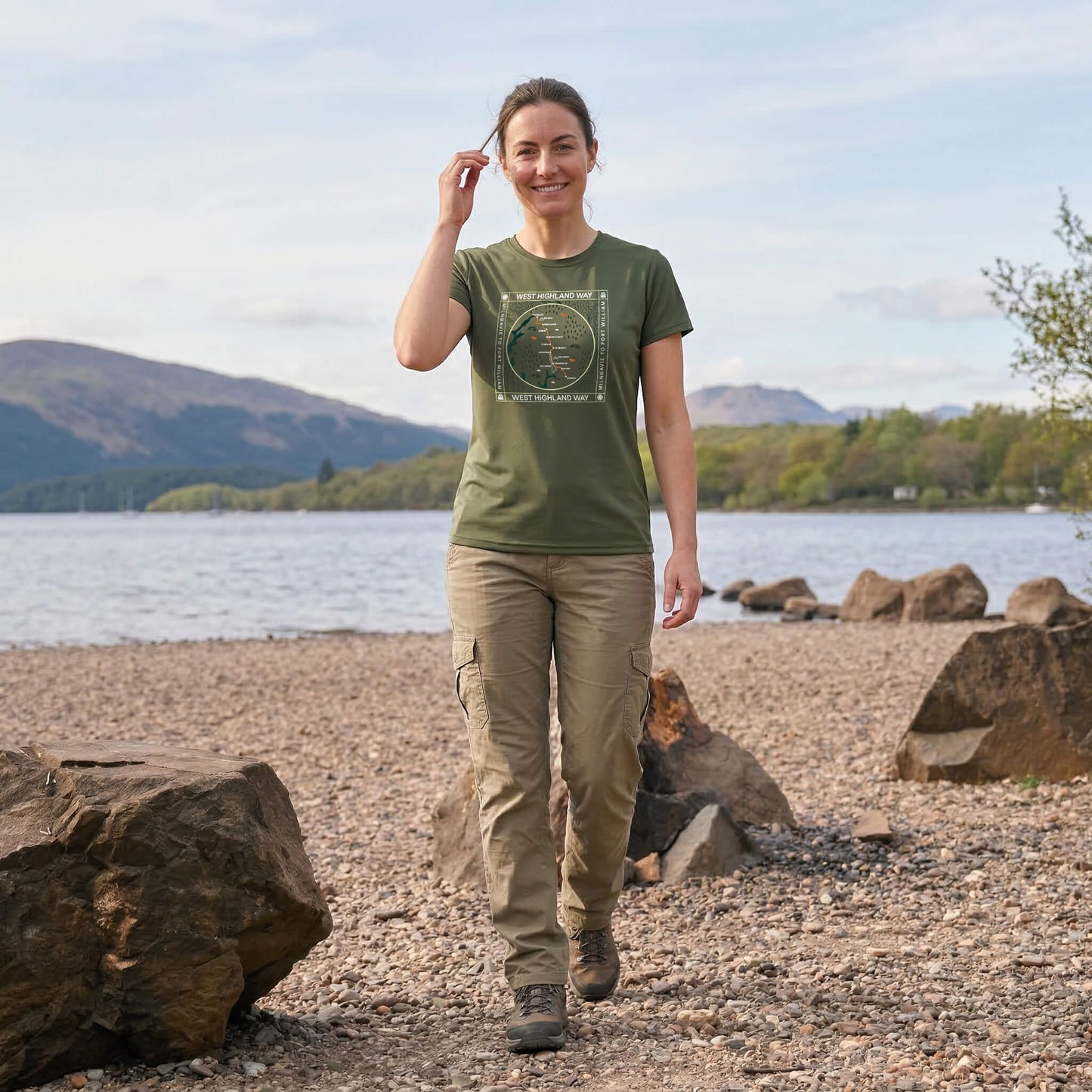 Woman wearing moss green west highland way map tech t-shirt