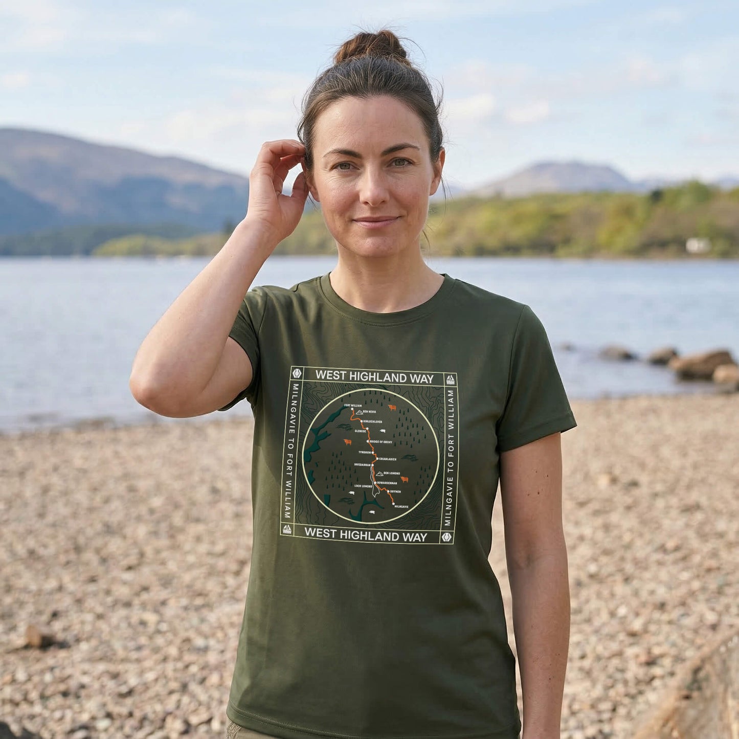Close up of woman wearing moss green west highland way map tech t-shirt