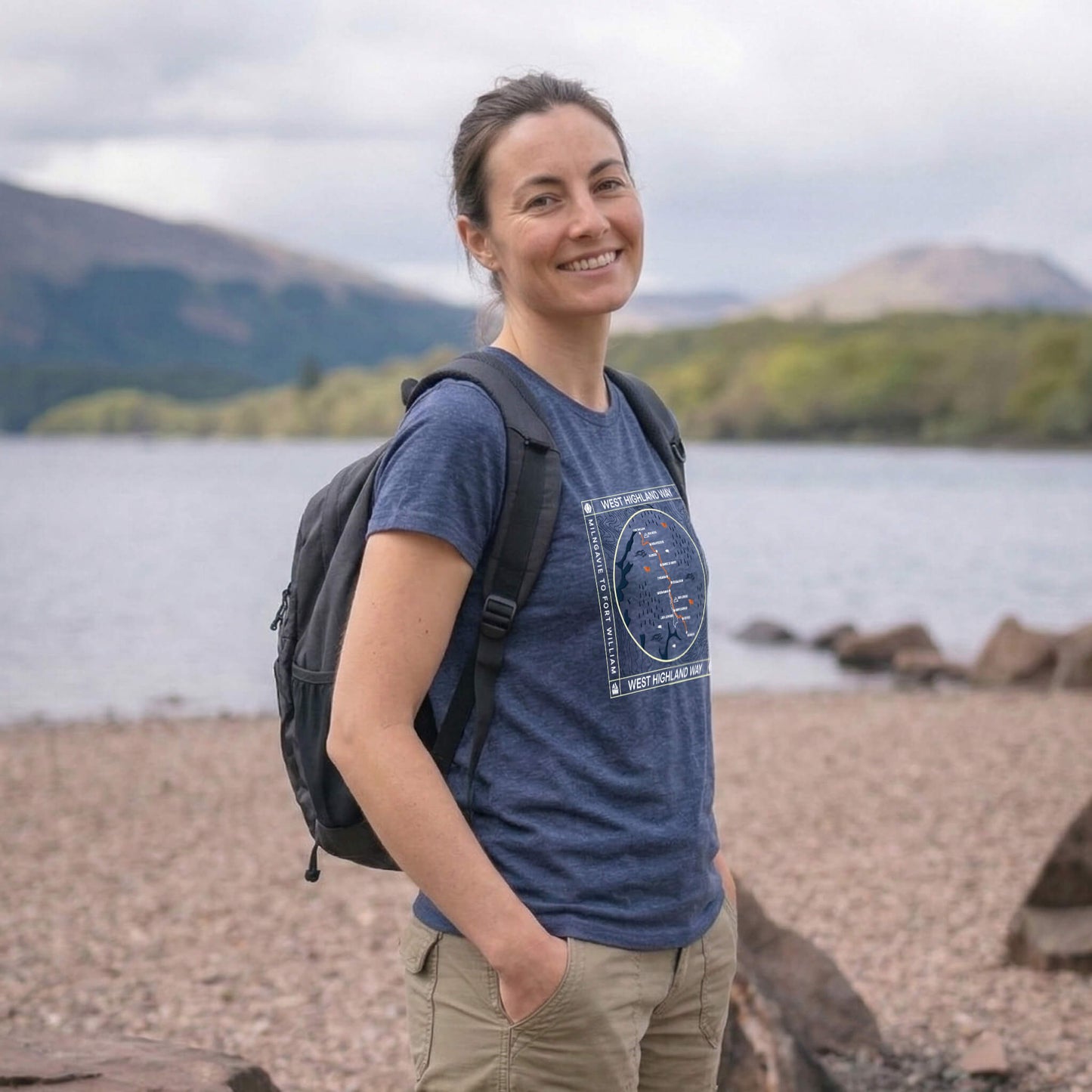 Side view of woman wearing blue steel west highland way map tech t-shirt