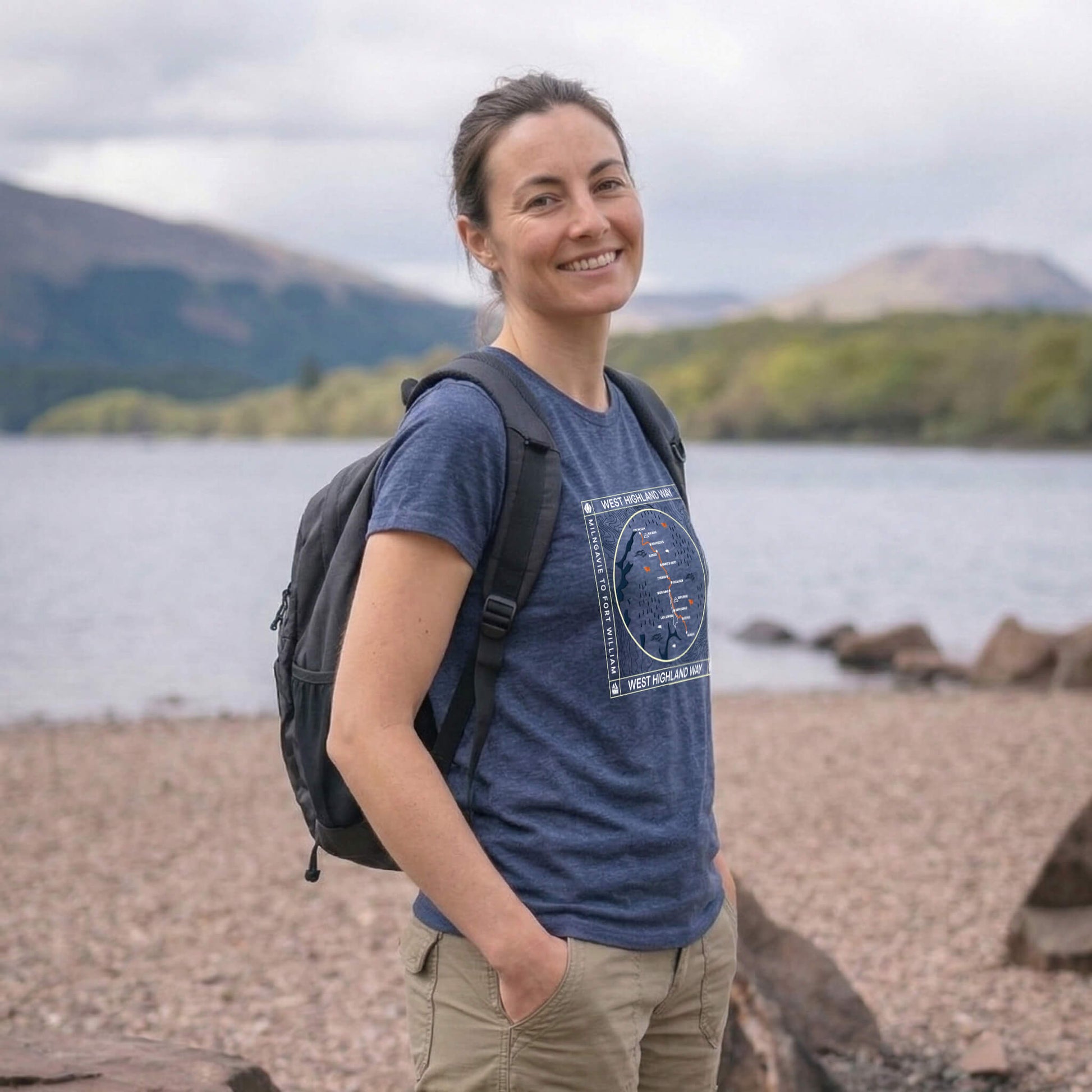 Side view of woman wearing blue steel west highland way map tech t-shirt